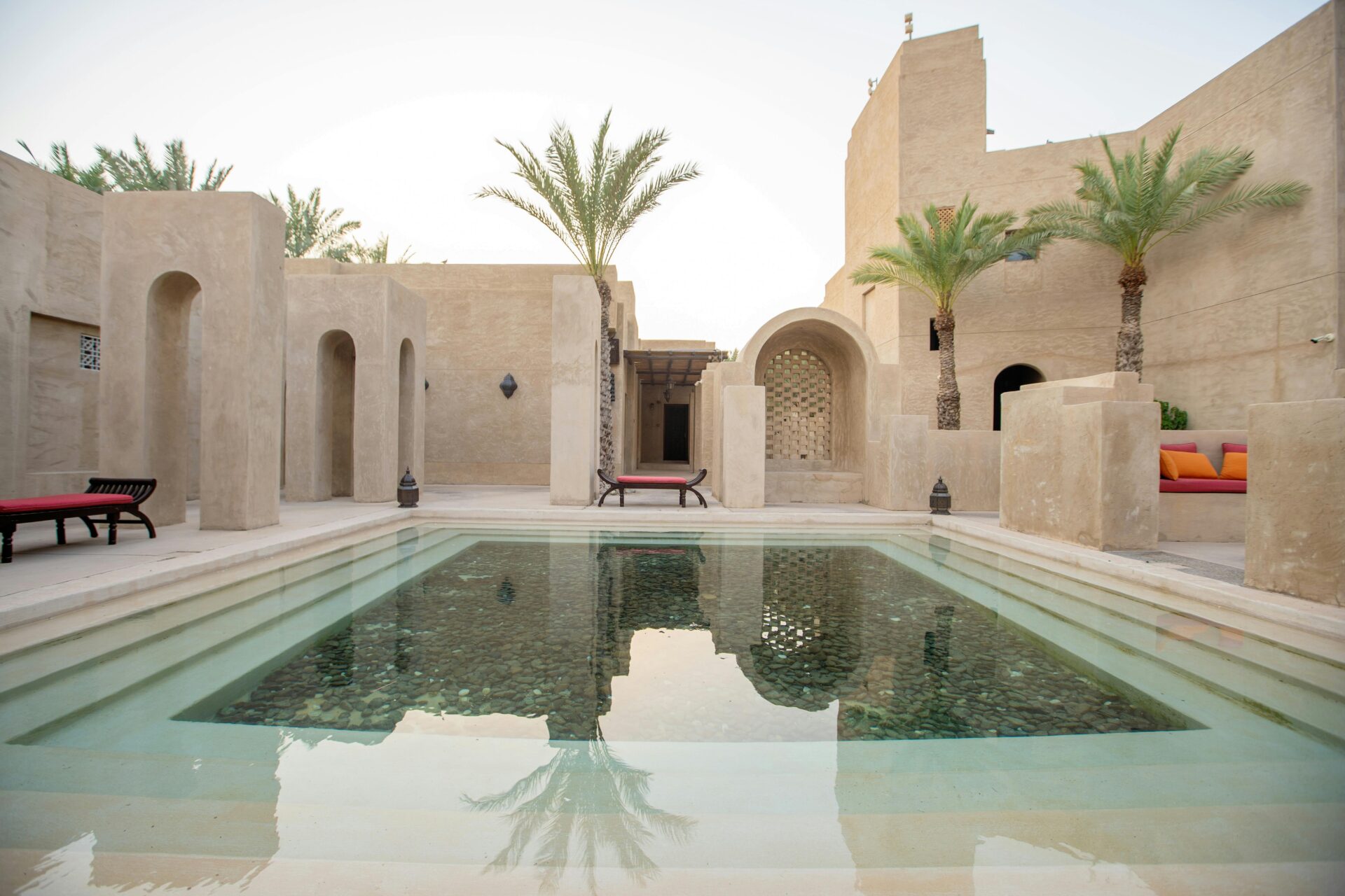 TRADITION AND FUNCTION | Shallow pools of water, a traditional feature in Dubai homes, are designed to enhance passive cooling and create a sense of calm.
